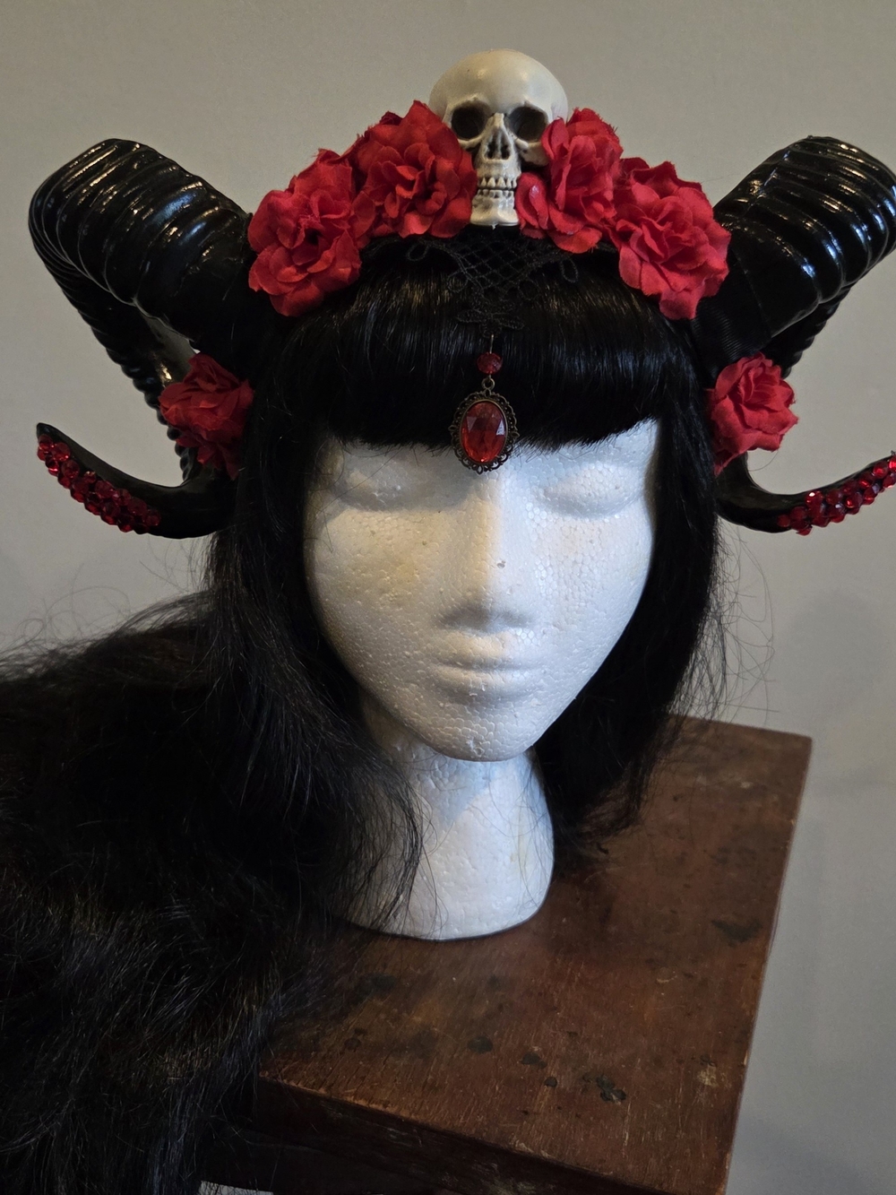Black Horned Hairpiece with Red Flowers and Skull Accent